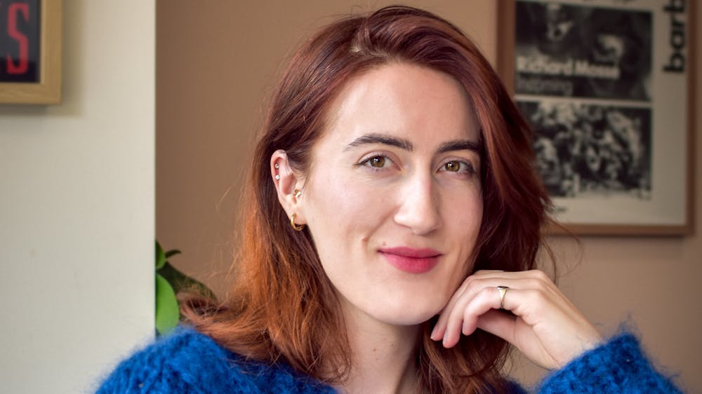 An image of author Laura McCluskey smiling at the camera.