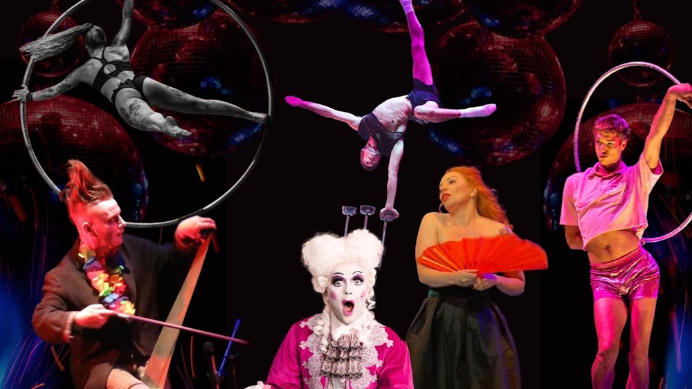 Cast of cabaret and circus performers in action