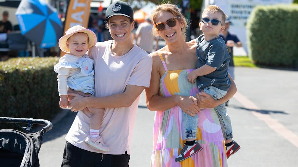 A family of four with big smiles enjoying the Outdoor Living & Caravan Expo