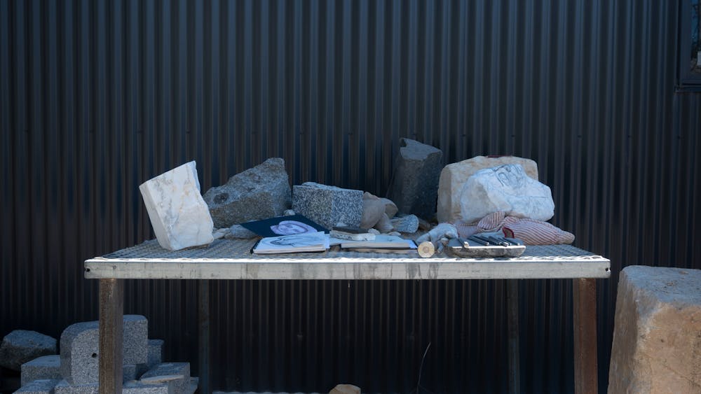 stone and carving implements on an outdoor table