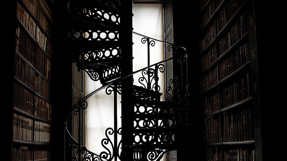 dark picture of heritage library spiral staircase