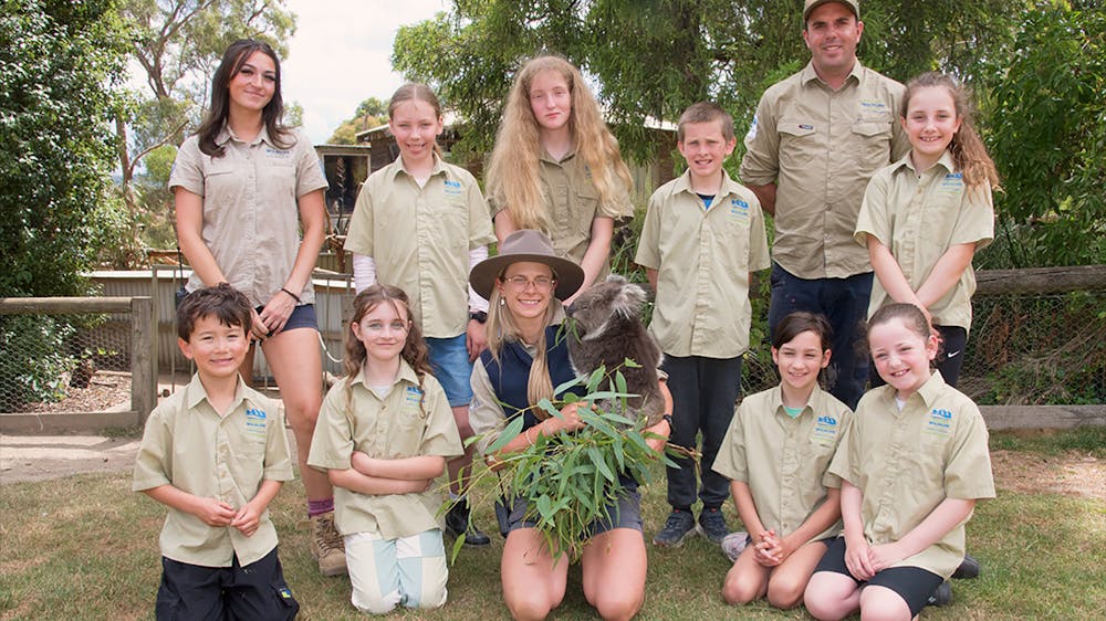Group of children as zoo keepers