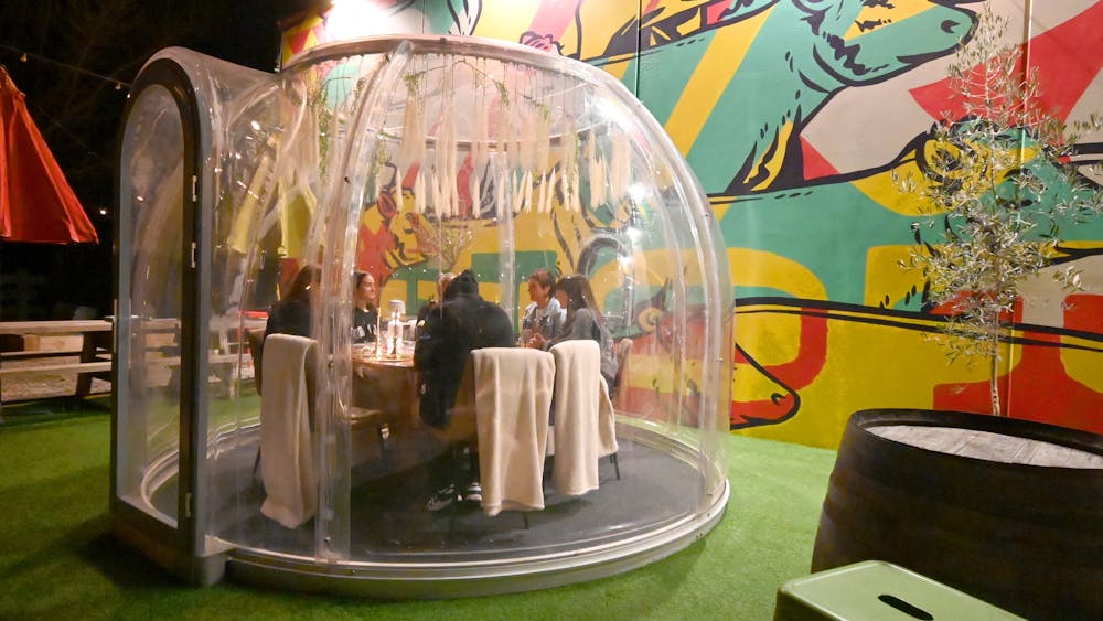 Winter Igloo in beer garden with dining chairs and table