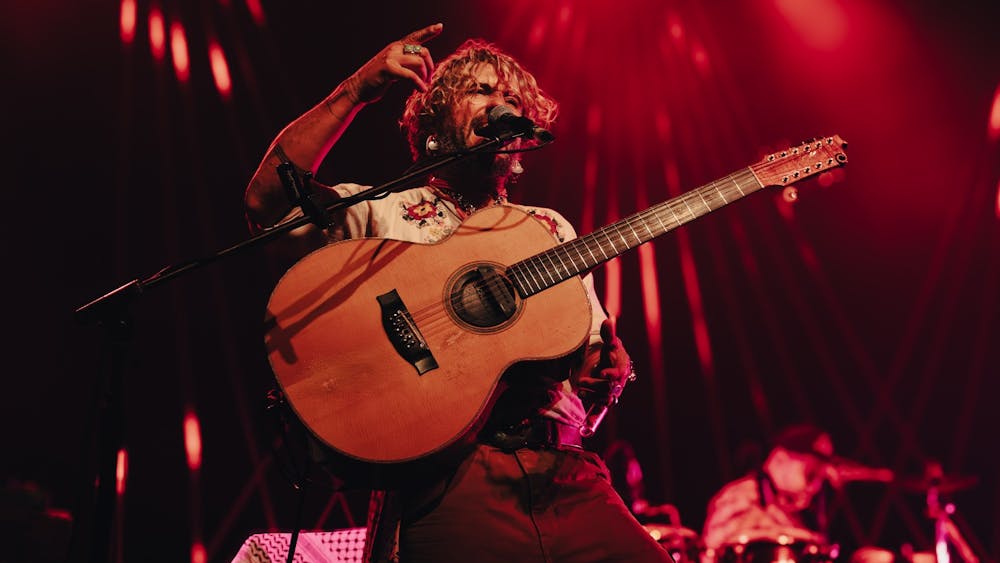 John Butler rocking out on stage at Civic Hall Ballarat