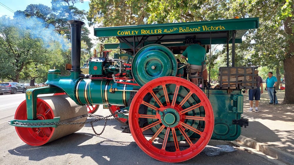 photo of an early steam powered road roller