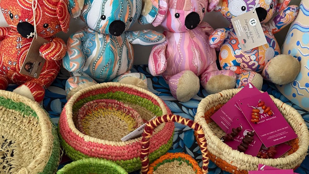 colourful koalas sitting behind hand woven baskets