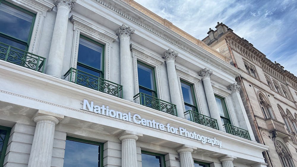 Exterior of a heritage listed  two-storey building with ornate columns.
