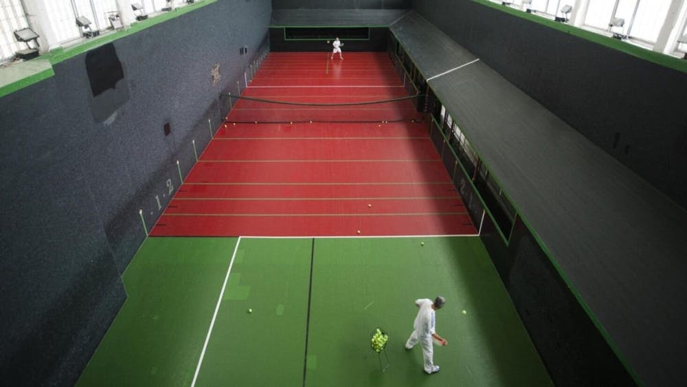people in a tennis court