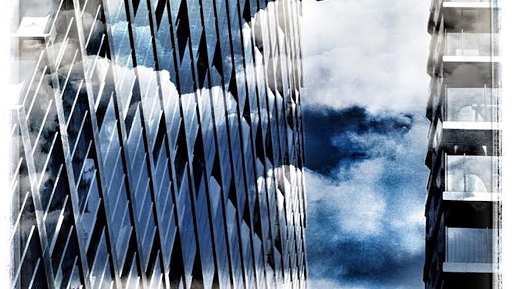 Blue sky with black and white buildings