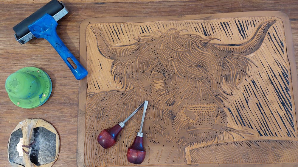 This iamge shows the lino cut tools uded to create Colin's prints