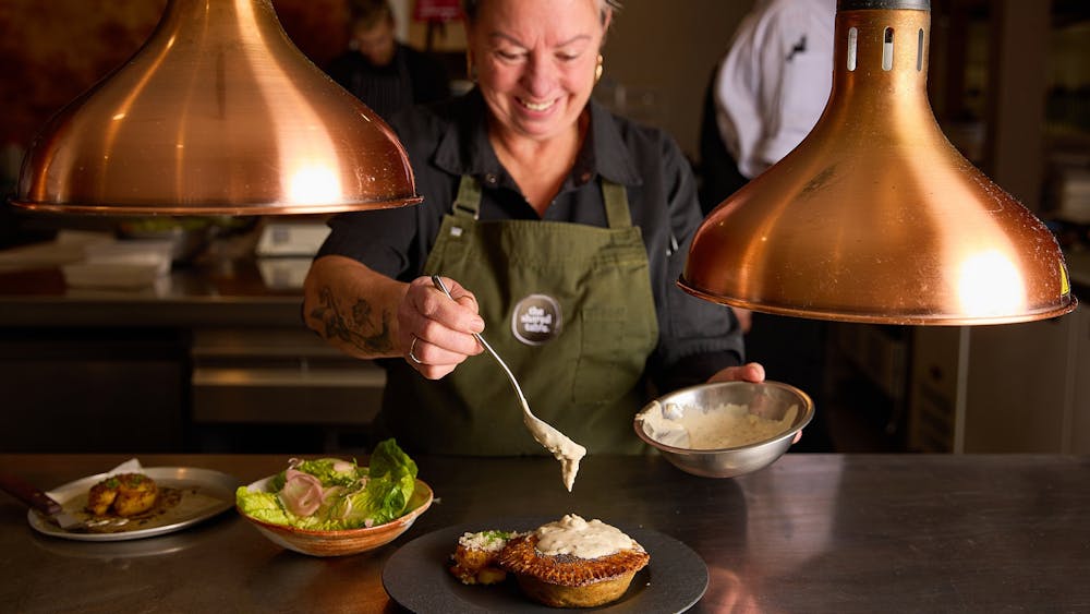 A chef adding garnish to a baked pie