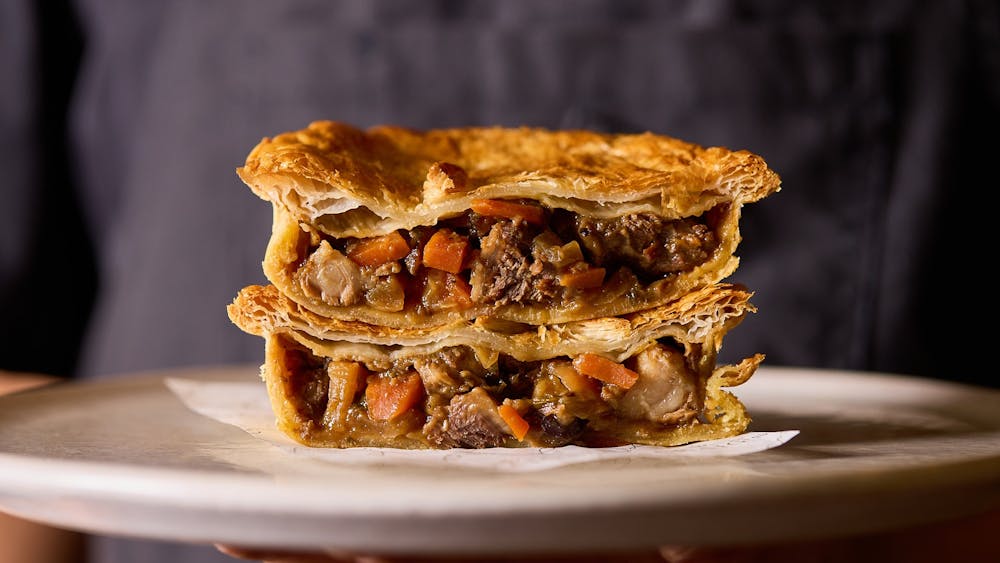 A pie cut in half stacked on top of one another