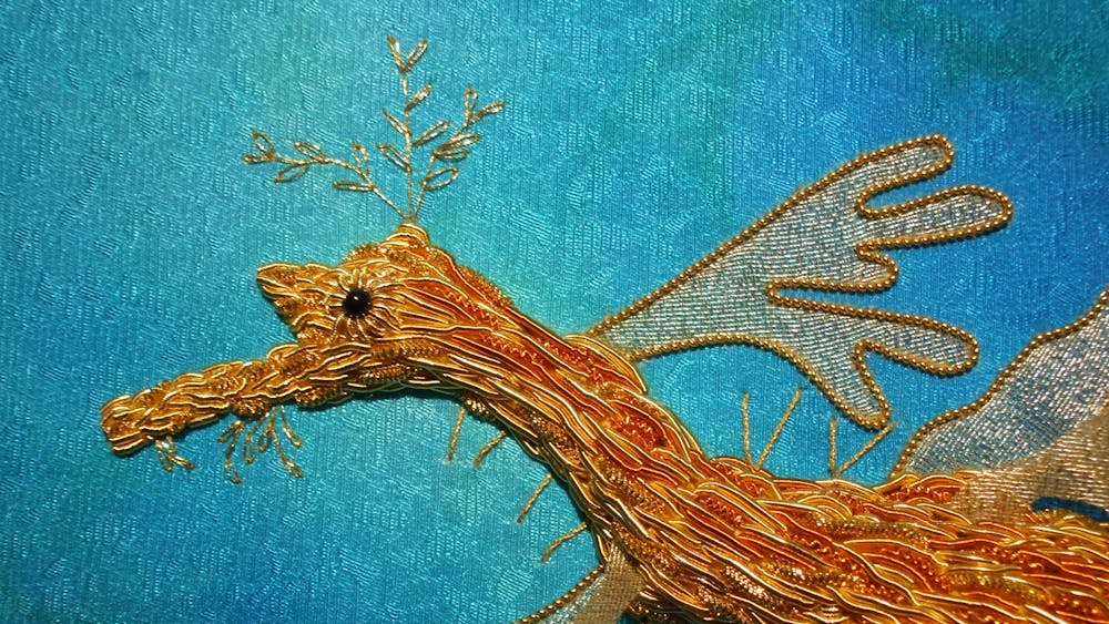 Goldwork embroidered seadragon close up