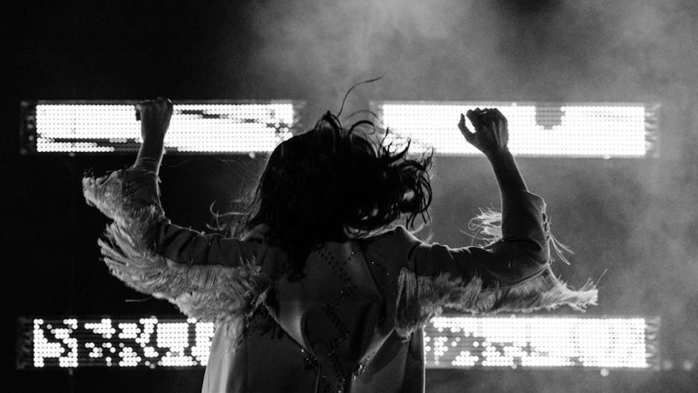Karin McCracken in black and white dancing in an atmospheric shot