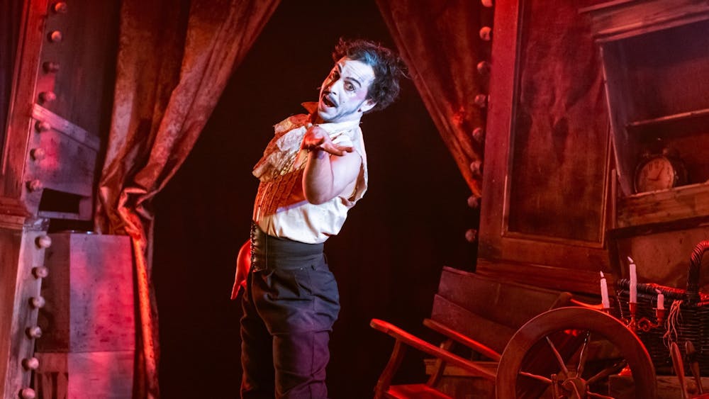 The narrator looking like a cabaret artist reaching out to you