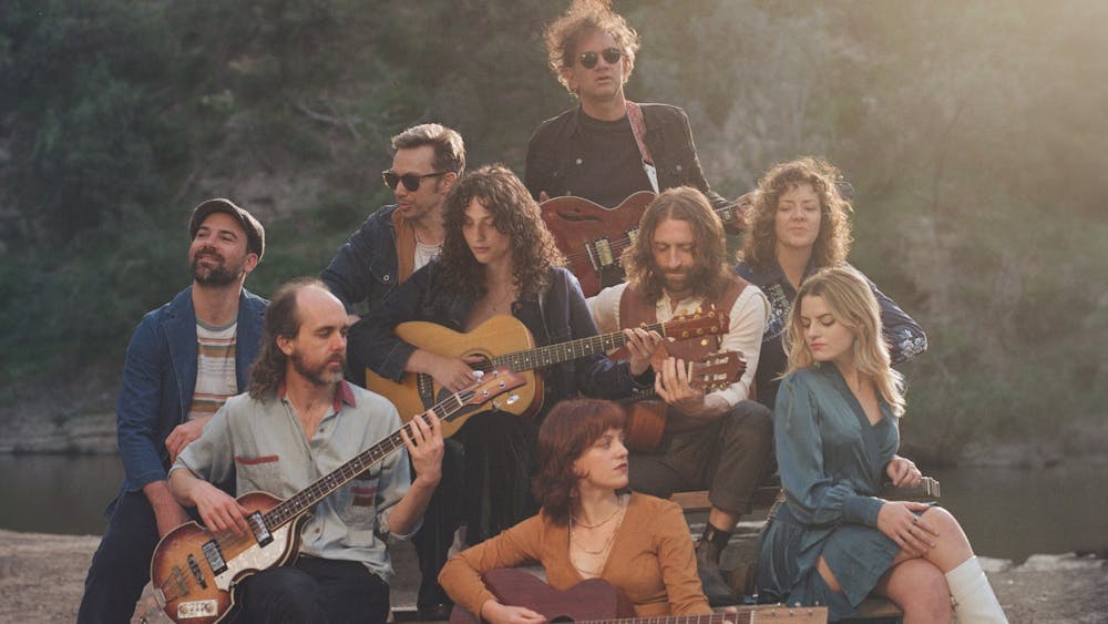 The band Songs from the Canyon sitting in nature
