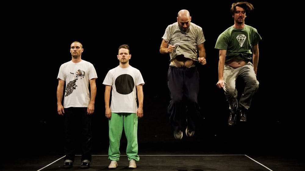 Four men on stage. Two are professional dancers. Two have no movement training at all.
