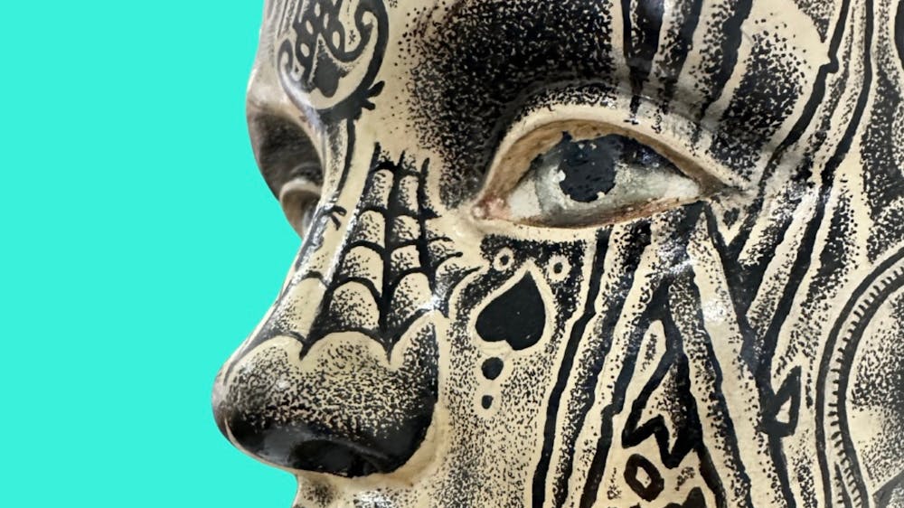 Tattoo style drawing on vintage mannequin head
