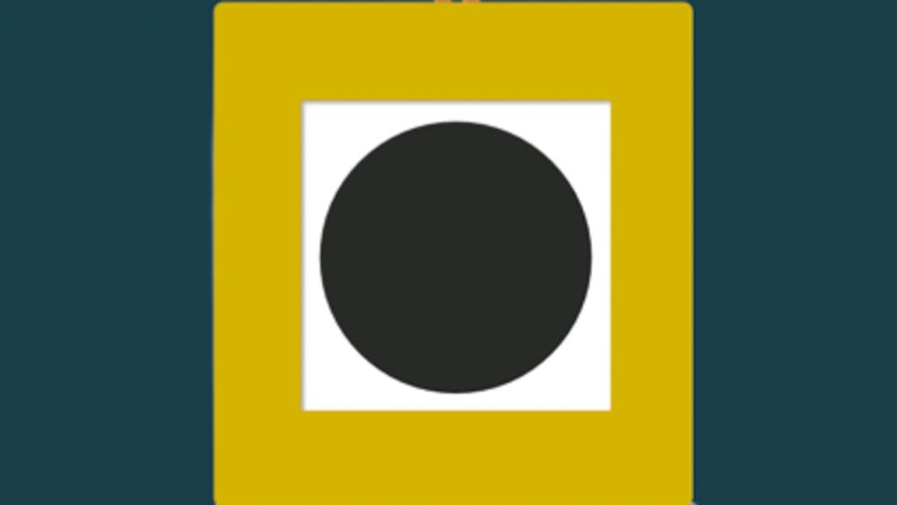a yellow square containing a white square containing a black circle