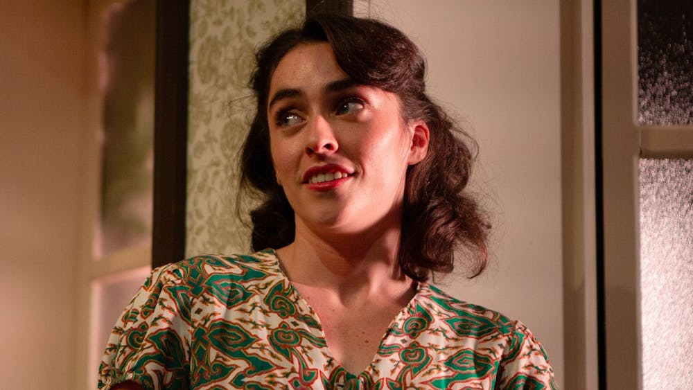 Close up of Bubba (Lucinda Smith) wearing a 1950s dress