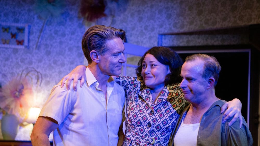 A teary Olive embraces her two cane cutters one final time