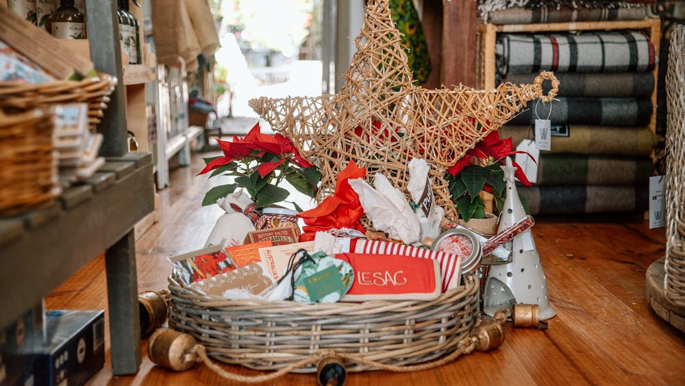 A basket of Christmas themed goods.