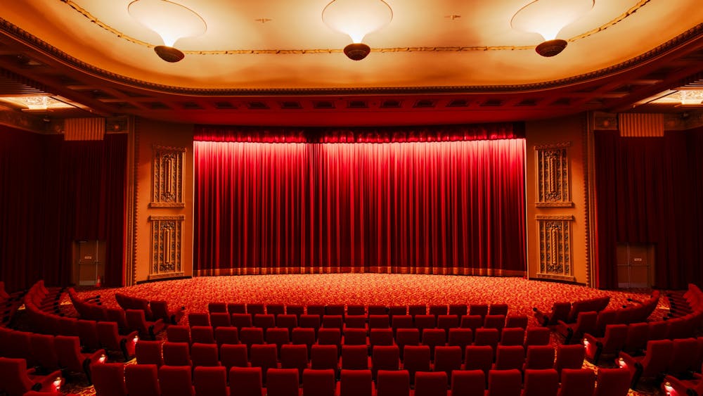 Inside of a cinema facing the curtains