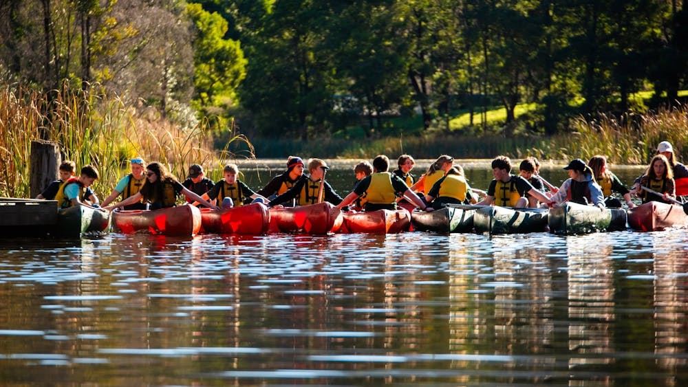 Campers enjoying time in the canoes
