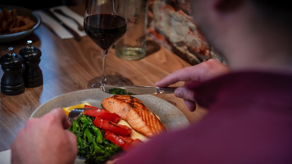 Guest enjoying a meal inside The North Star Hotel restaurant.