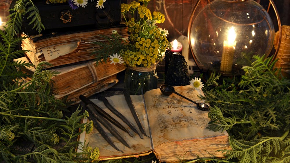 ancient books, nestled amongst theraputic fresh herbs