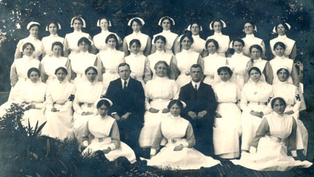 Group black and white photo of nurses and 2 physicians - November 1917