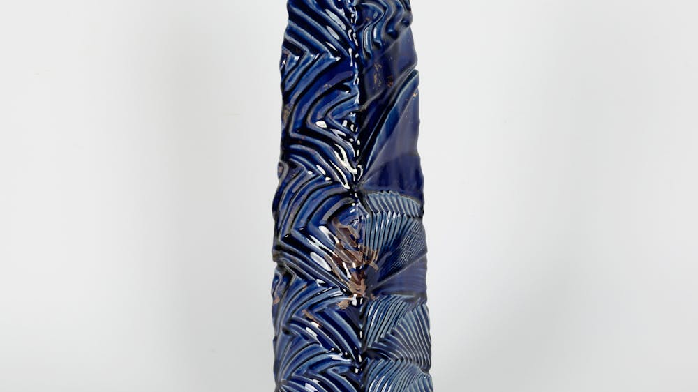 Tall blue handbuilt vase