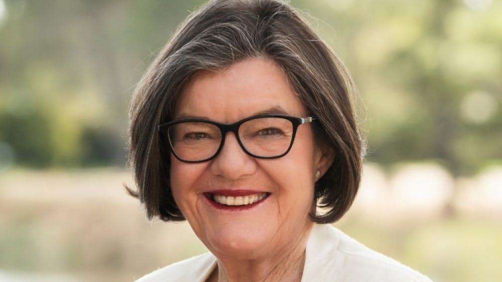 a lady facing the camera and smiling