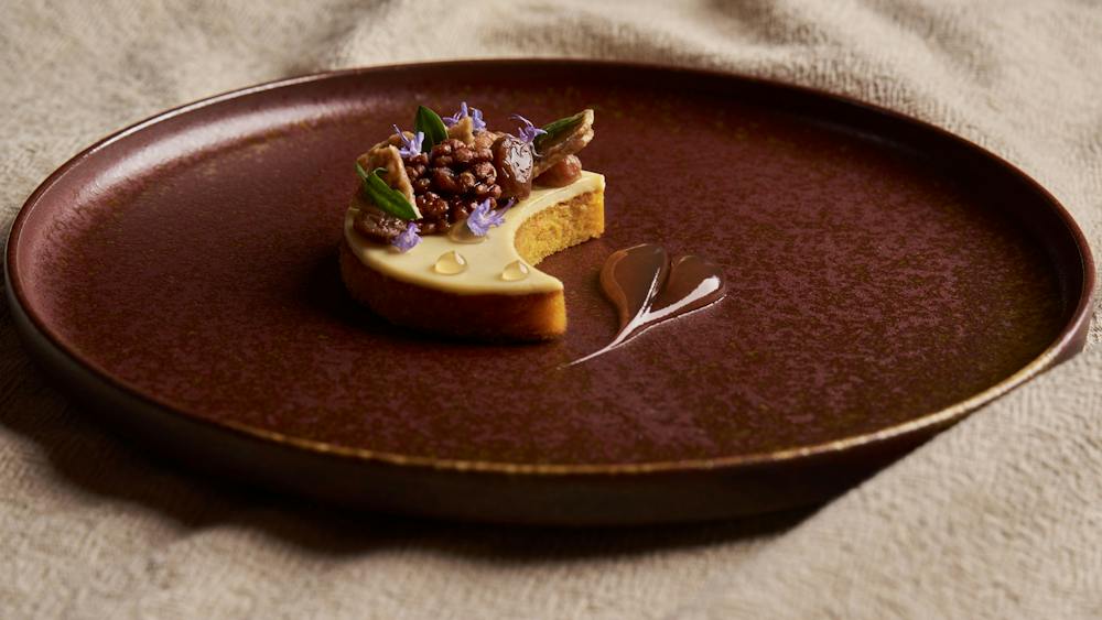 Pumpkin Cake, Crème Fraîche, Candied Boonderoo Walnuts, Sultanas, Pumpkin Seed Nougatine, Maple Gel