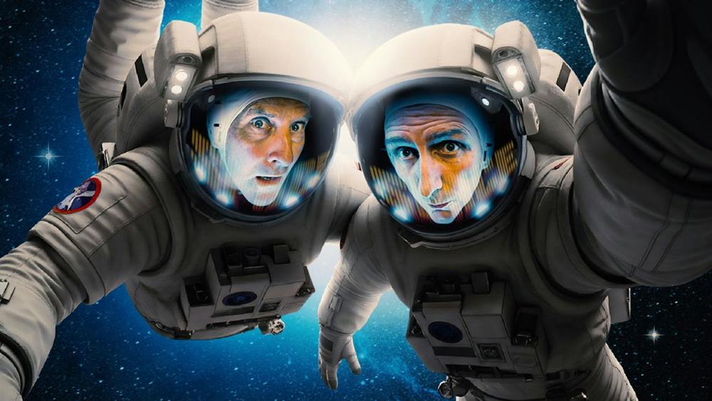 Colin Lano and Frank Woodley dressed as astronauts and floating in space looking worried