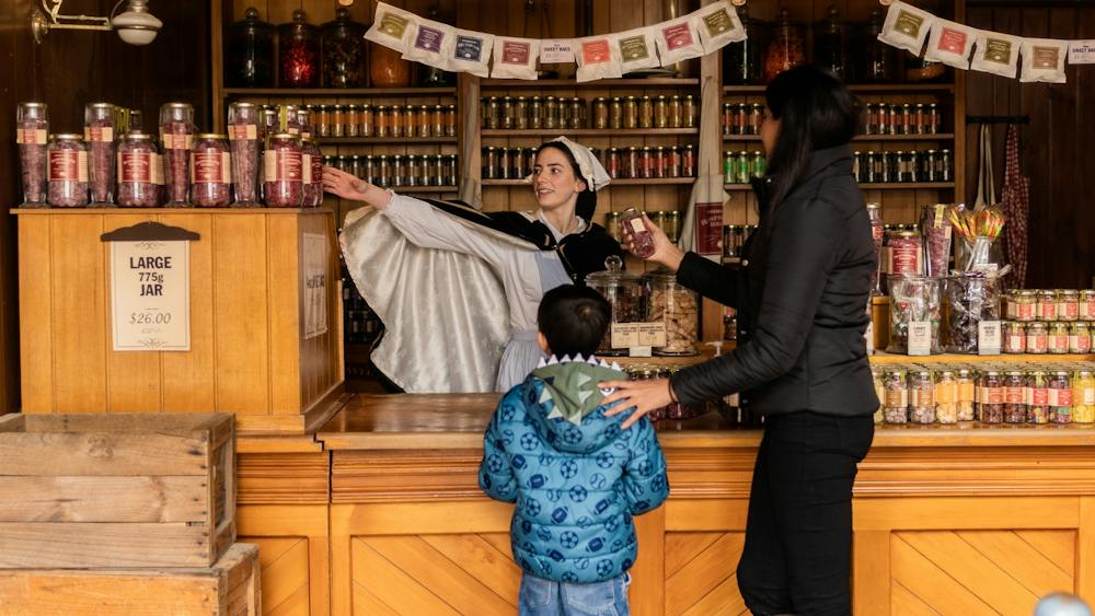 Mother and son inside Sovereign Hill confectionary store