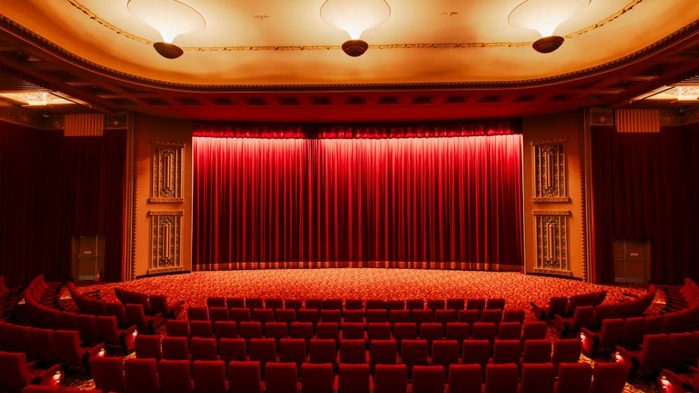 Inside of a cinema facing the curtains