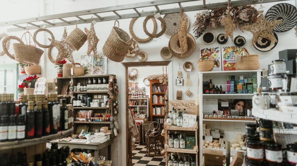 Inside of shop with hanging baskets from ladder