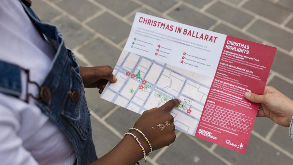 Child pointing at map