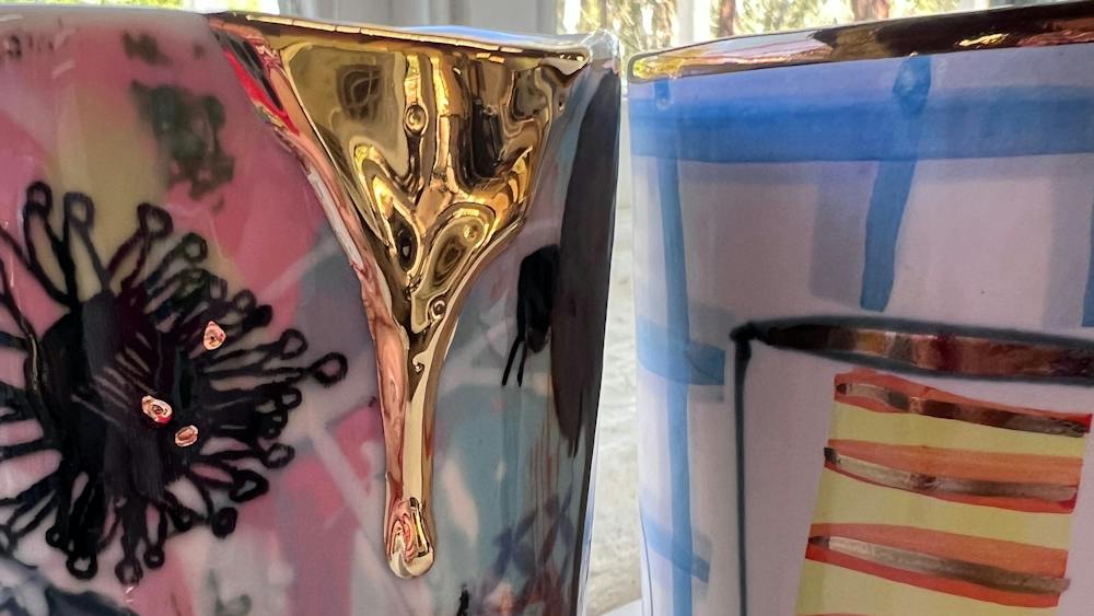 Two colorful pots next to each other