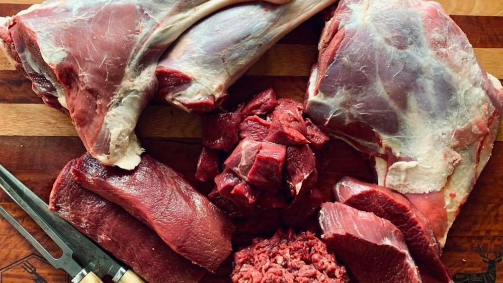 Different cuts of wild venison on a chopping board