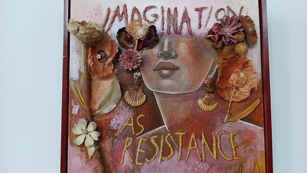 Mixed media artwork with the lower half of a woman's face and the words 'Imagination as Resistance'