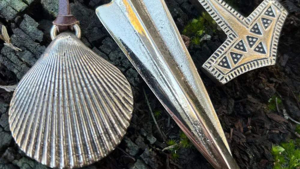 Set of three bronze pendants