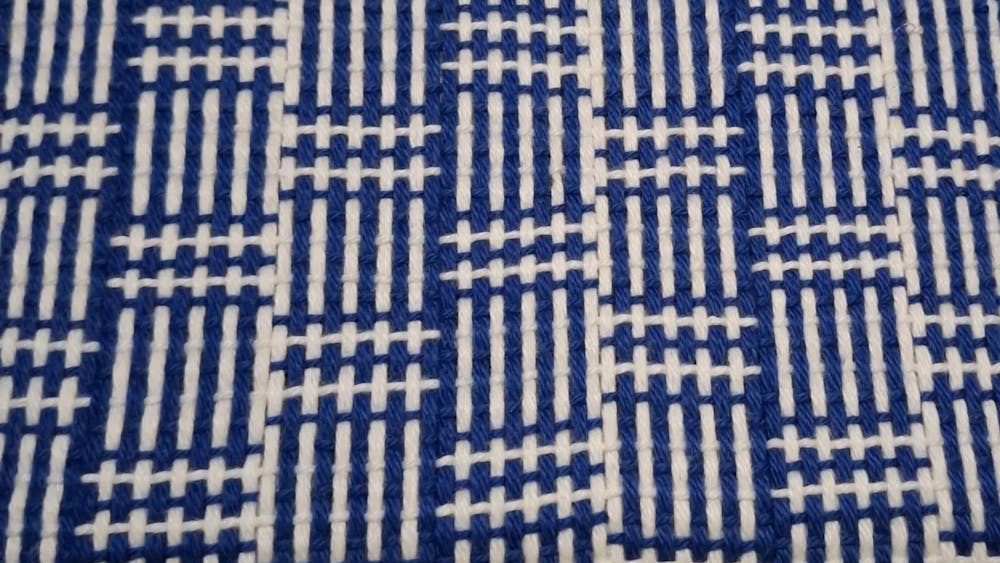 Blue and white woven fabric