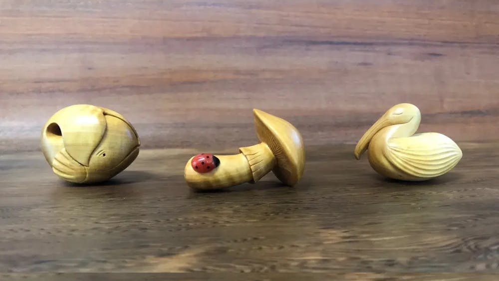 Three handcarved wooden statues