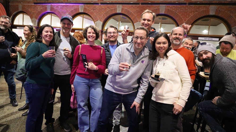 A group of attendees smiling for the camera