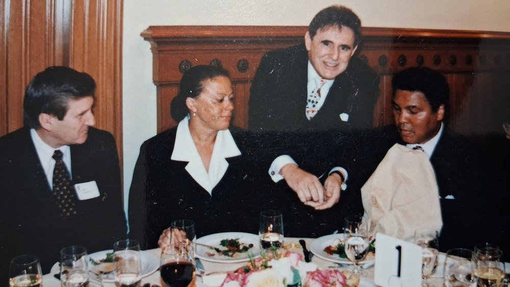 vintage images of Barry performing slight of hand at the dinnner table