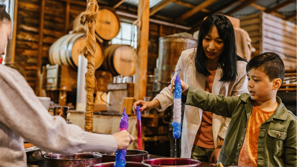 Mum and daughter candle dipping