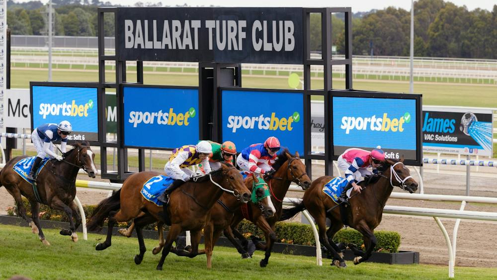 Horses going past the winning post.