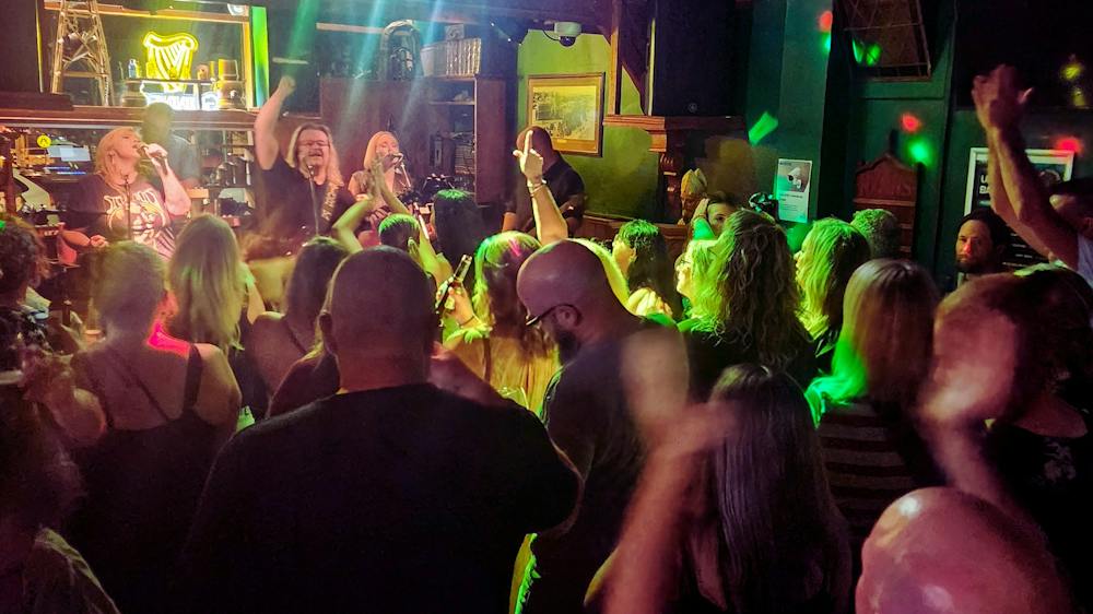 The crowd is dancing to the live music